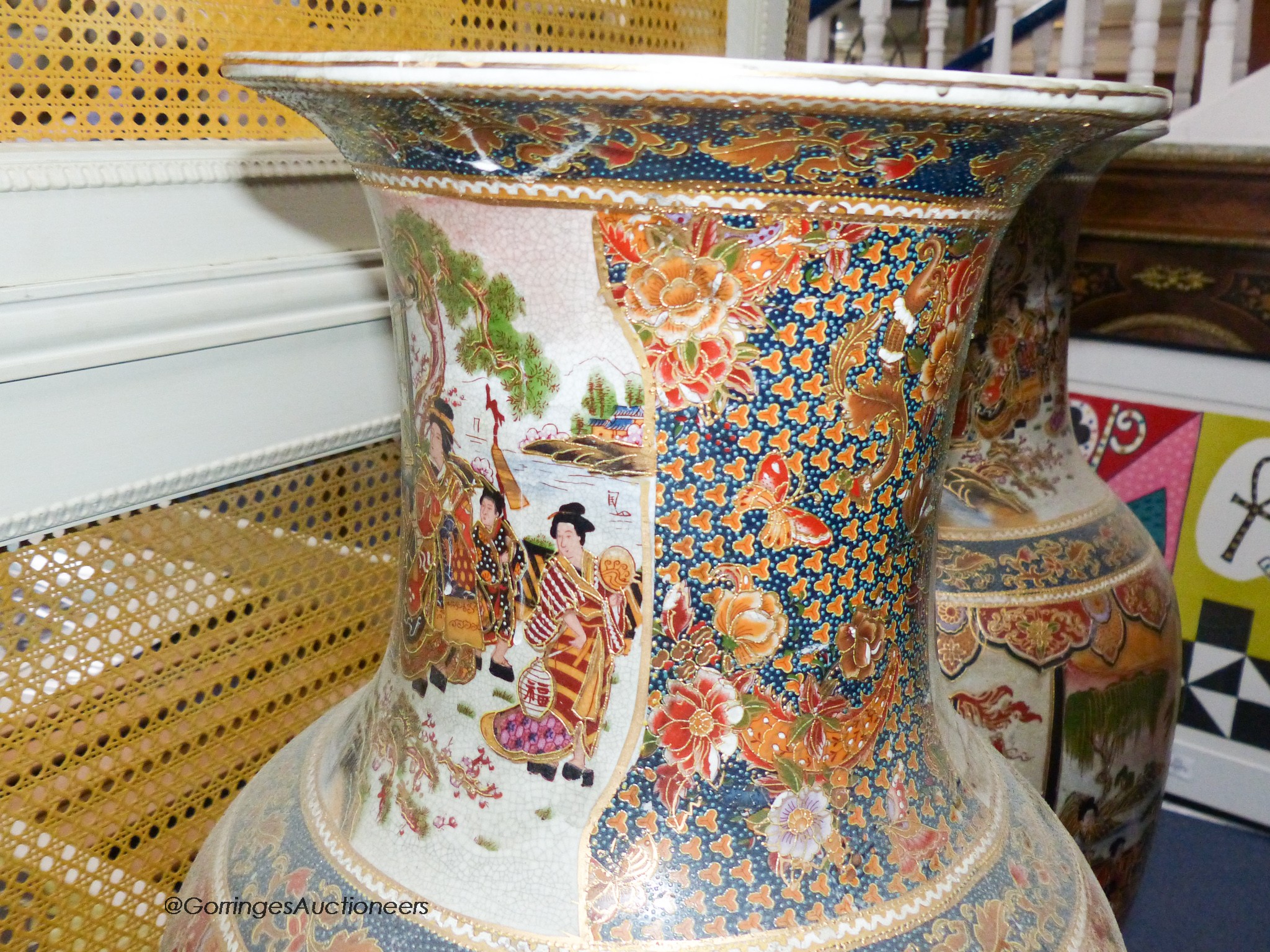 A pair of large Japanese vases, on hardwood stands